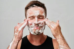 men's skincare being applied to face
