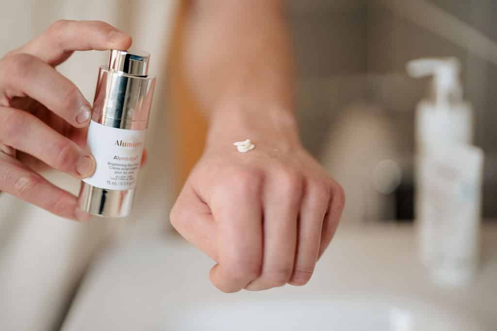 Person using AlumierMD product on their hand